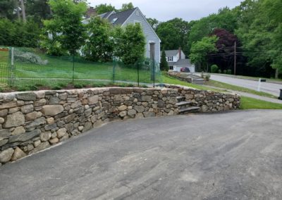 fieldstone retaining wall in Westborough MA built by Ideal Landscape