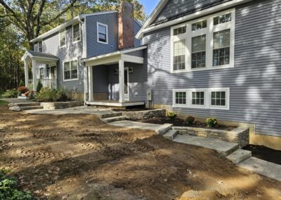 Tiered walkway stairs and stone wall in Rutland Ma by Ideal Landscape